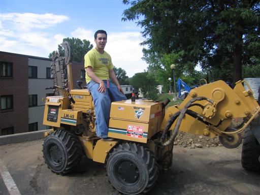 Me riding on an asphalt cutter